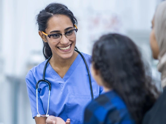 Intern reaching out to young patient