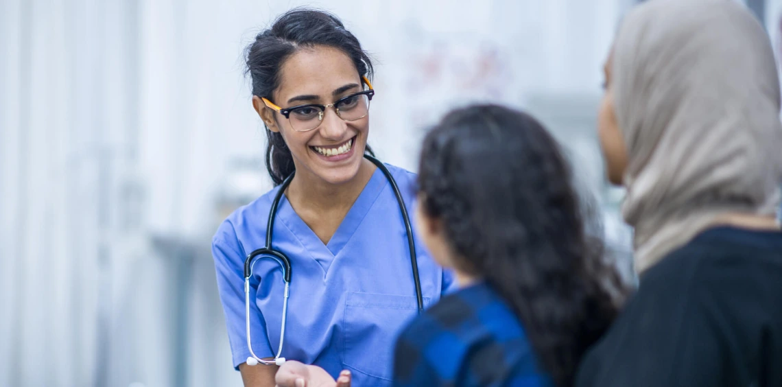 Intern reaching out to young patient